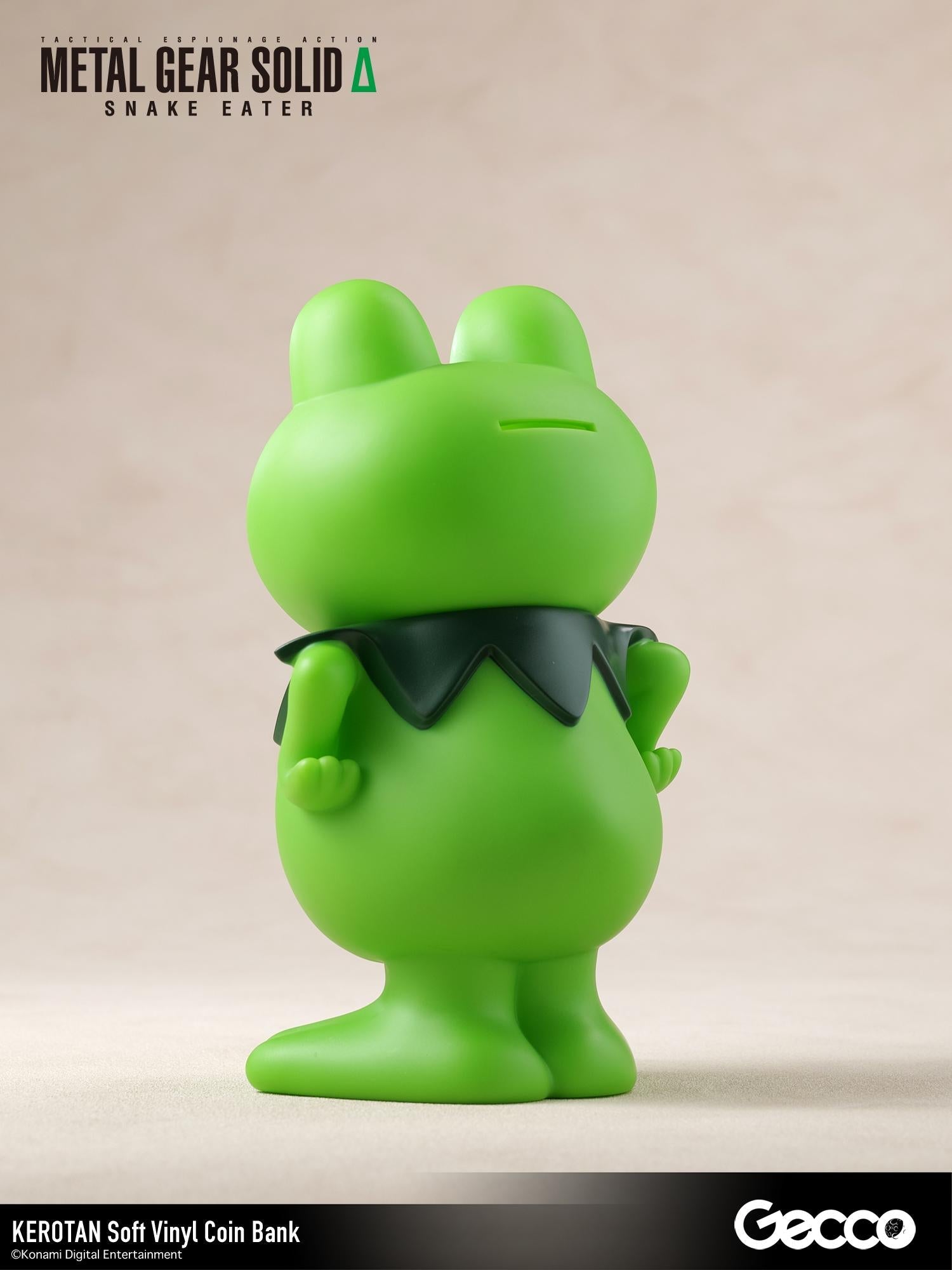 Rear three-quarter view showing the coin slot on the head of the Kerotan soft vinyl coin bank.