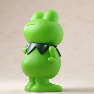 Rear right-side perspective of the green Kerotan vinyl coin bank figure.