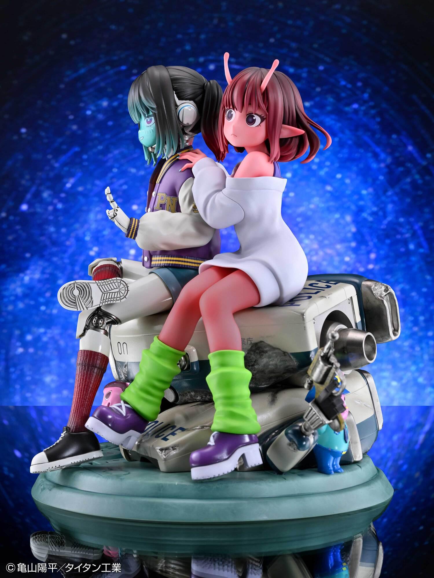 Right side view of the Chiharu and Makina figure displayed against a blue space galaxy background.