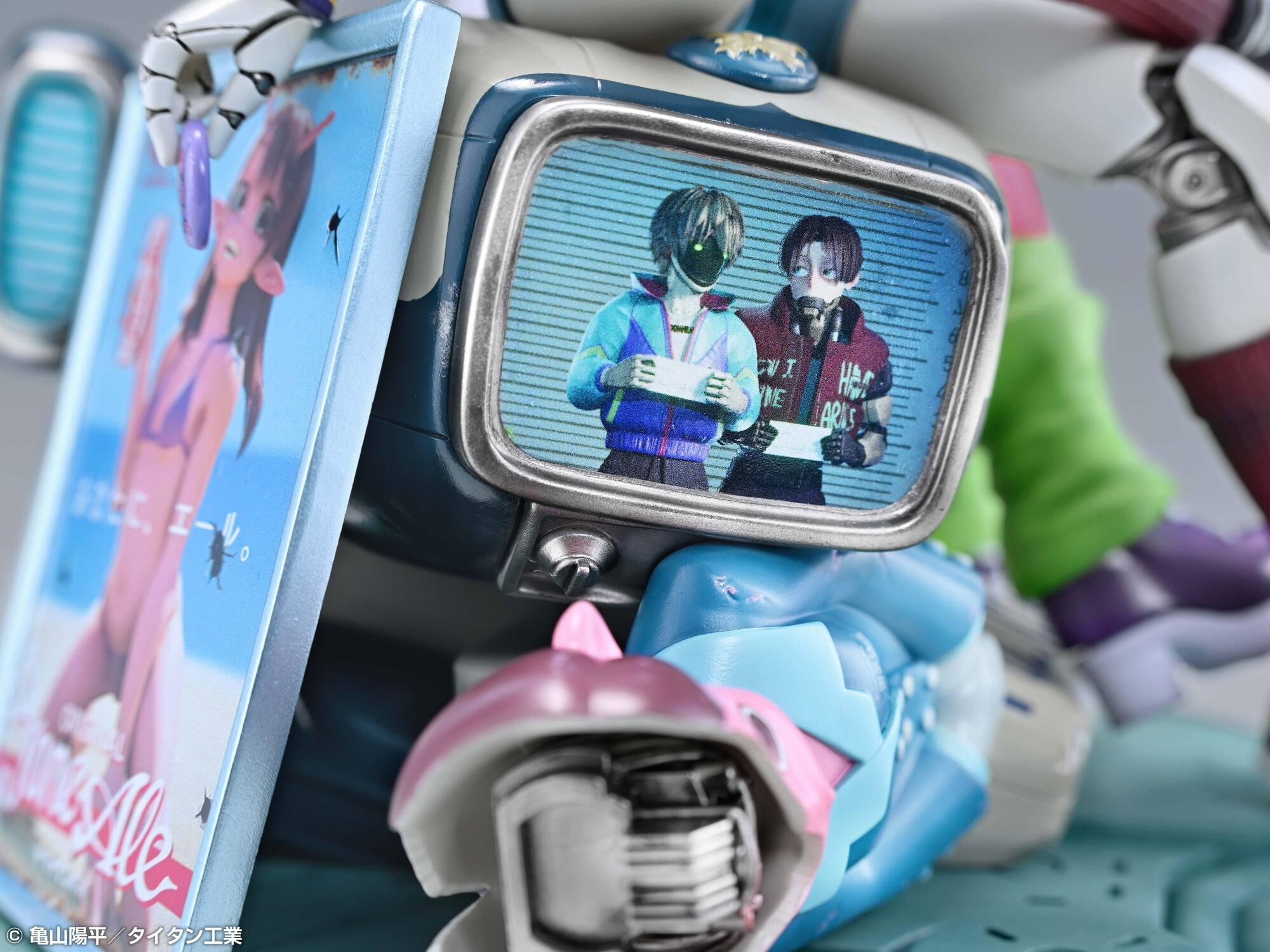 Close-up view of the base detail showing a retro monitor screen displaying alien characters holding mugshot boards.