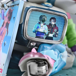 Close-up view of the base detail showing a retro monitor screen displaying alien characters holding mugshot boards.