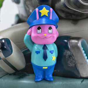 Close-up view of the small pink alien police officer mascot figure saluting on the diorama base.