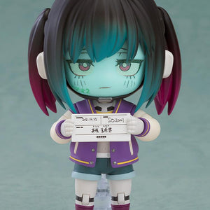 Makina Nendoroid figure with a glaring face plate, blue-toned skin, and dark pigtails wearing a purple varsity jacket.