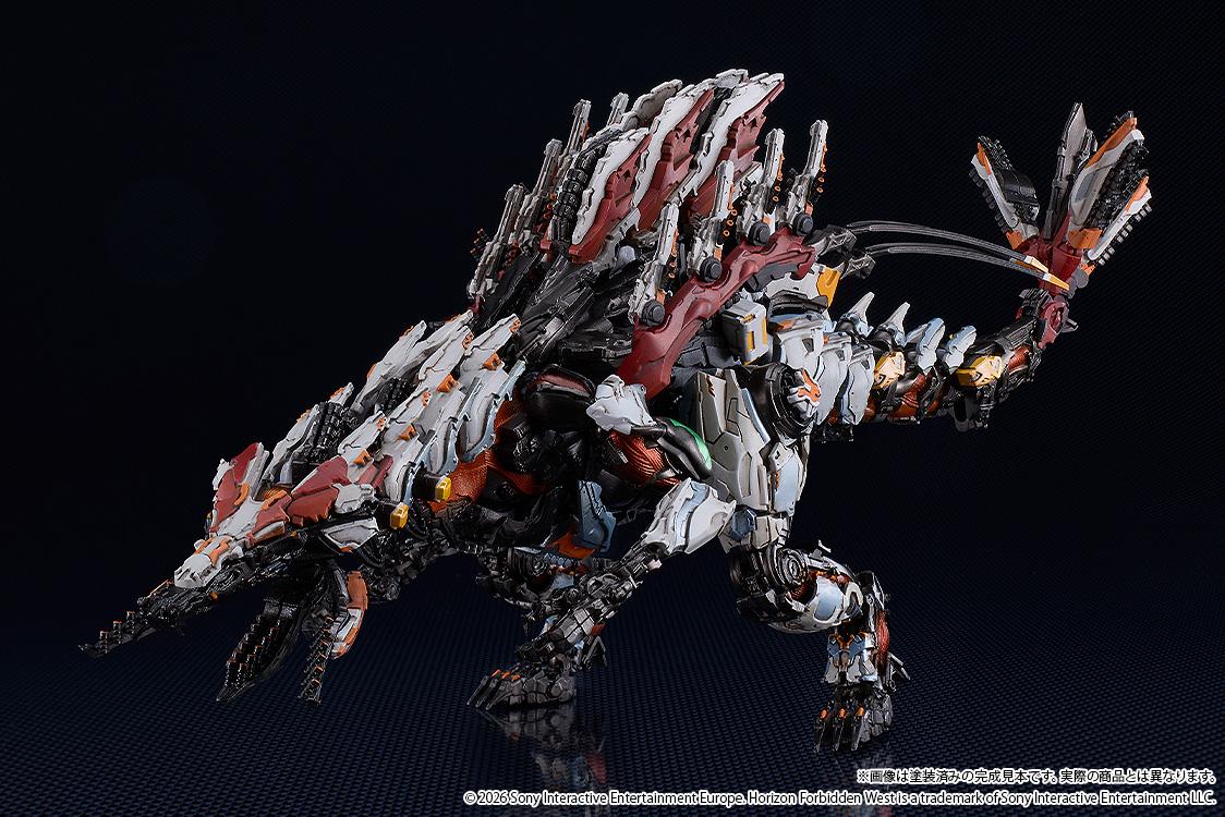 Angled view of the Slaughterspine model kit standing on a reflective surface, highlighting the white, red, and orange armor plating and mechanical joints.