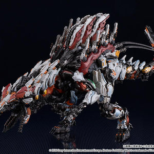 Angled view of the Slaughterspine model kit standing on a reflective surface, highlighting the white, red, and orange armor plating and mechanical joints.