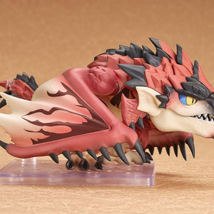 Side view of the Rathalos Nendoroid figure in a low crouching position with folded wings resting on a display base.