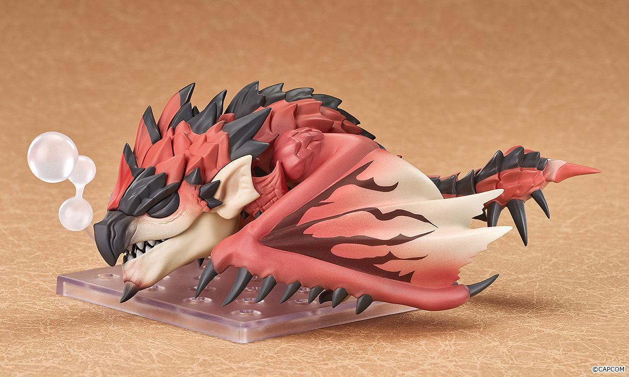Rathalos Nendoroid figure lying down with closed eyes using the clear sleeping bubble effect accessory.