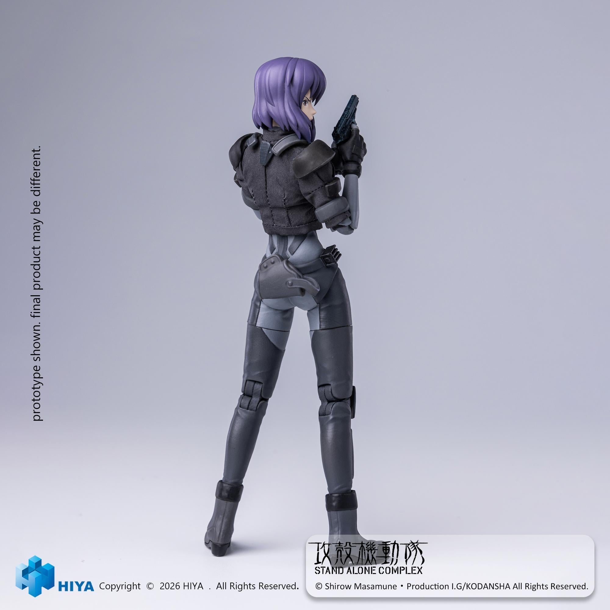 Rear view of the Ghost in the Shell Motoko Kusanagi action figure looking over her shoulder with a handgun raised.