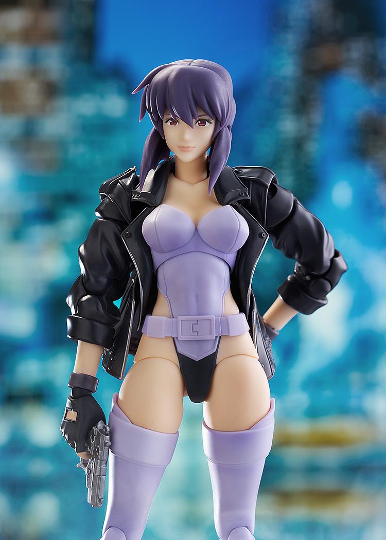 Close-up of the Motoko Kusanagi figure featuring the pre-painted smiling face plate and detailed leather jacket sculpt.