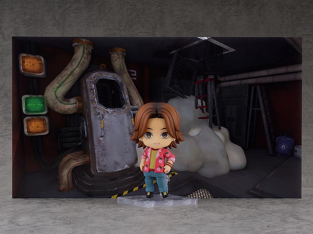 Daisuke Nendoroid figure displayed with the included utility room background paperboard diorama.