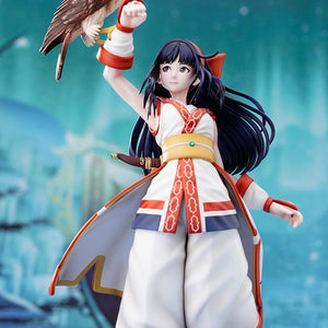 Front view of Nakoruru figure with hawk Mamahaha posed against a blue snowy mountain backdrop