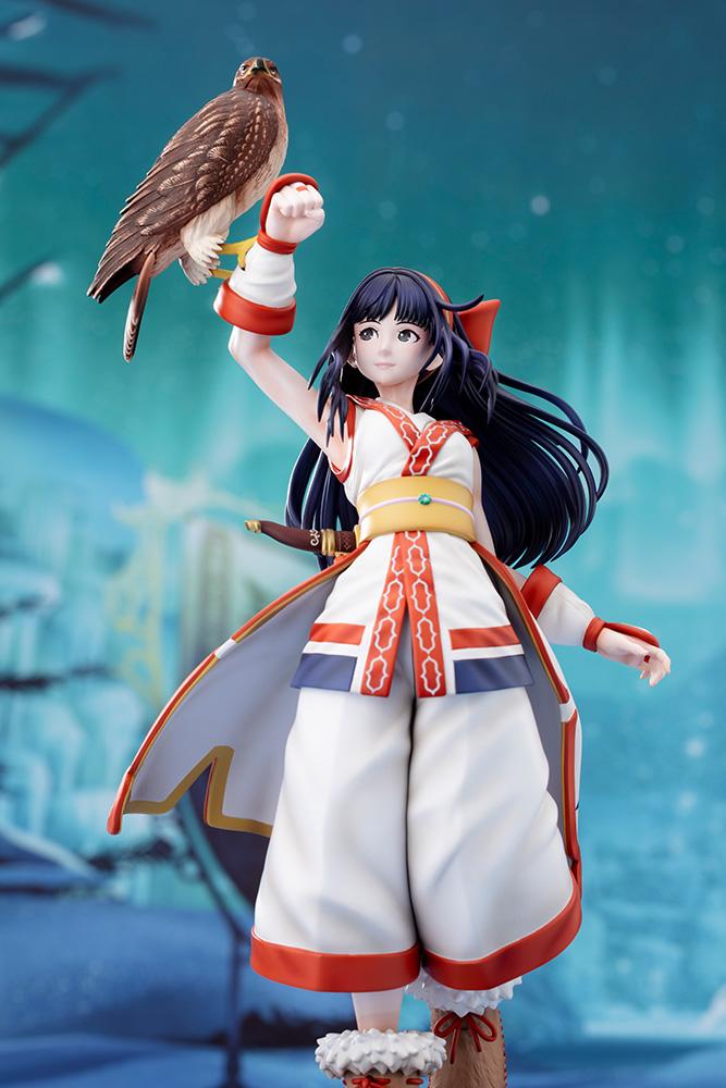 Front view of Nakoruru figure with hawk Mamahaha posed against a blue snowy mountain backdrop