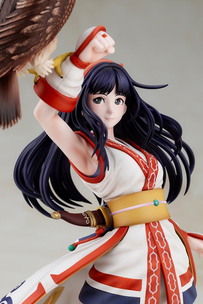 Close-up portrait of Nakoruru figure featuring her gentle smile, dark eyes, and detailed bangs