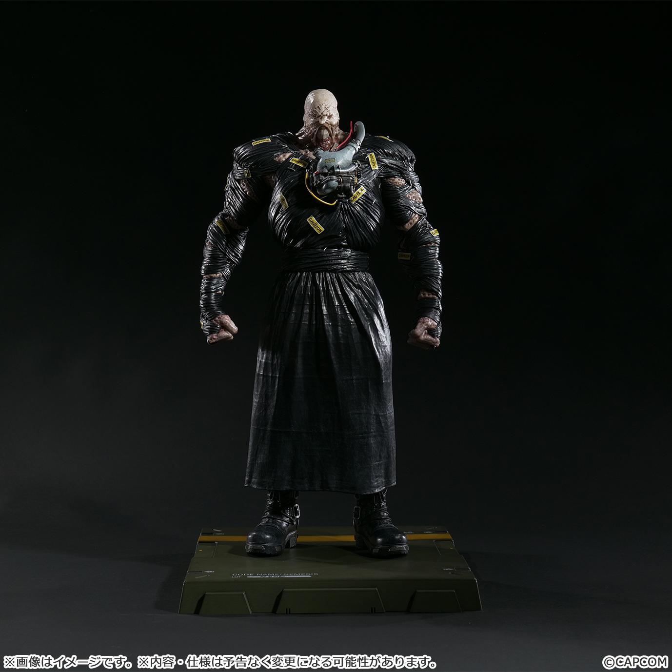 Full-length front view of the Nemesis Creator's Model figure standing on its base against a dark, dramatic background.