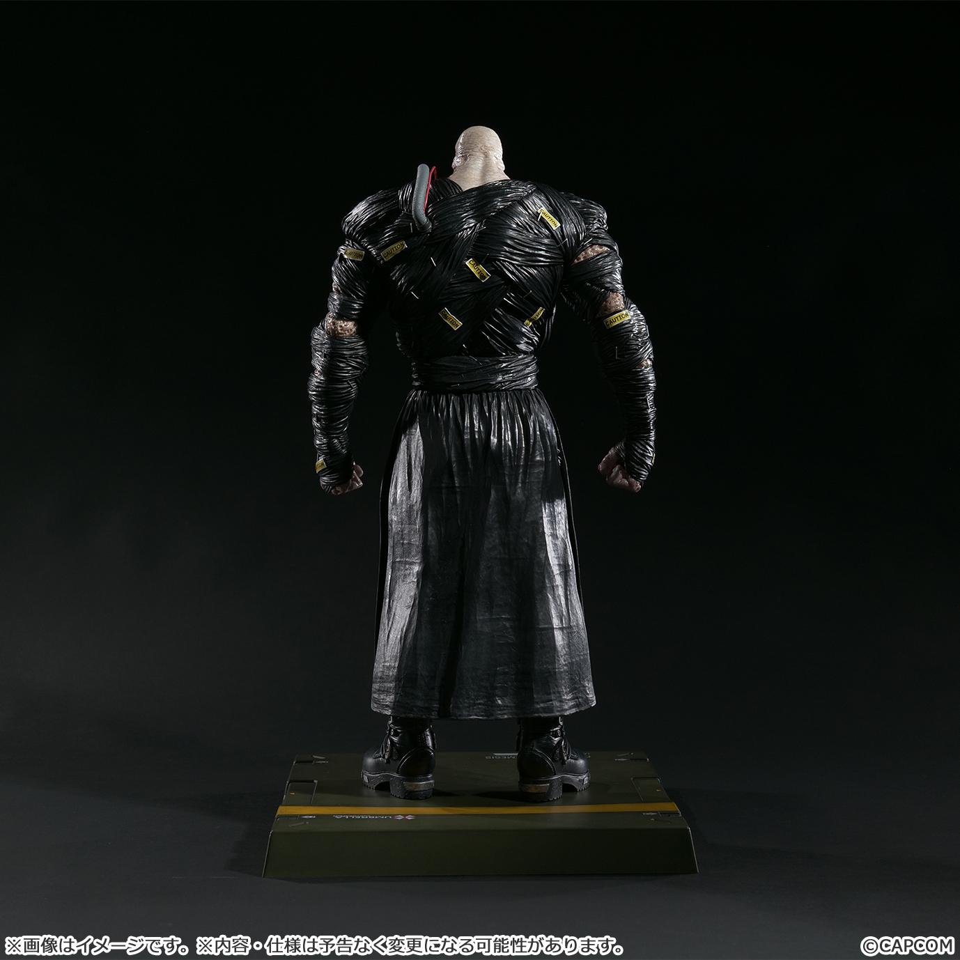 Rear view of the 1/6 scale Nemesis figure showing the detailed caution tape accents and the structural design of the back wrappings.