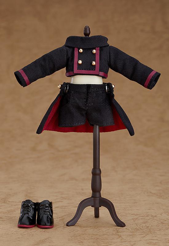 The black and burgundy cloth outfit for the Devil: Berg Nendoroid Doll displayed on a miniature black mannequin stand, with short black boots alongside.