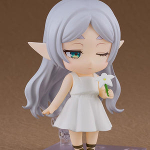 Frieren Nendoroid featuring a one-eye-closed face plate, holding a white flower accessory.