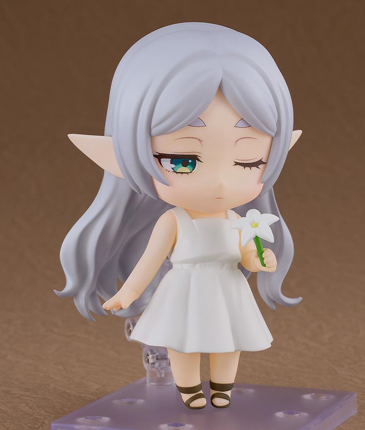 Frieren Nendoroid featuring a one-eye-closed face plate, holding a white flower accessory.