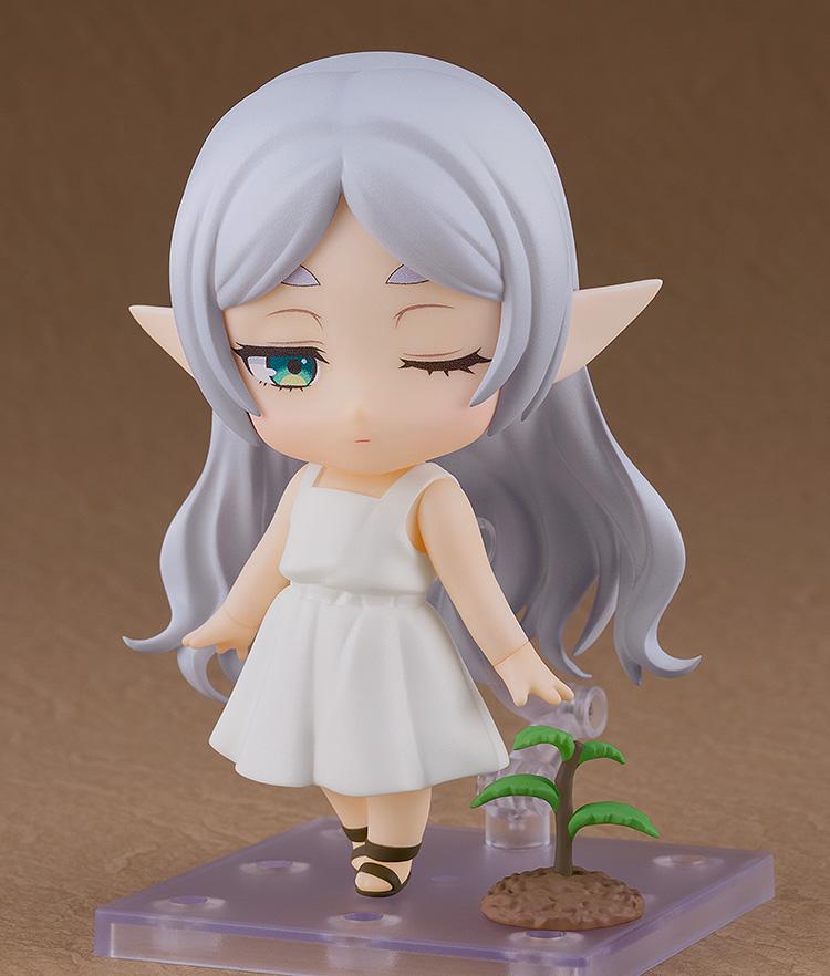 Posed shot of Frieren Nendoroid looking down at a small seedling accessory, featuring the one-eye-closed face plate.