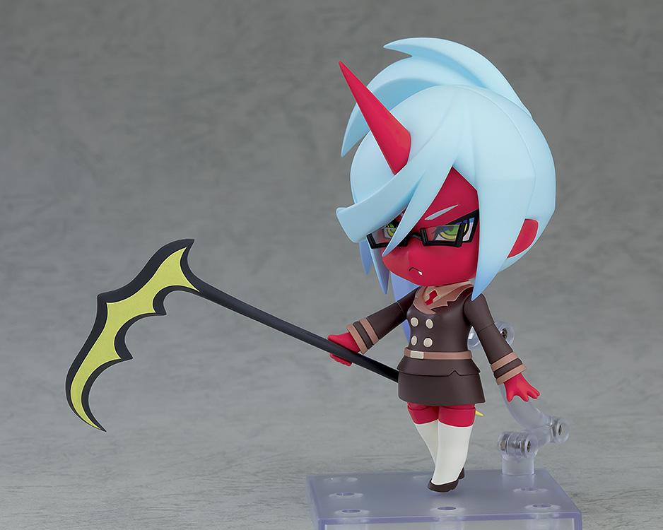 Dynamic side angle pose of the Kneesocks Nendoroid action figure trailing her long scythe weapon behind her on a clear plastic stand.