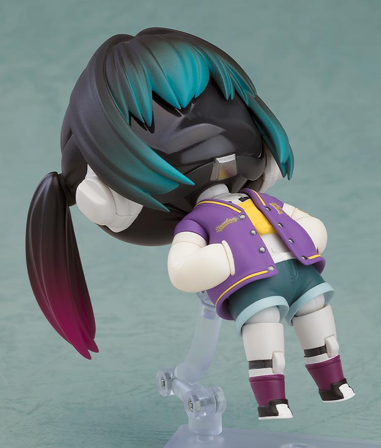 Dynamic pose of the Makina Nendoroid leaning back on her stand, showcasing the pigtail and jacket details.
