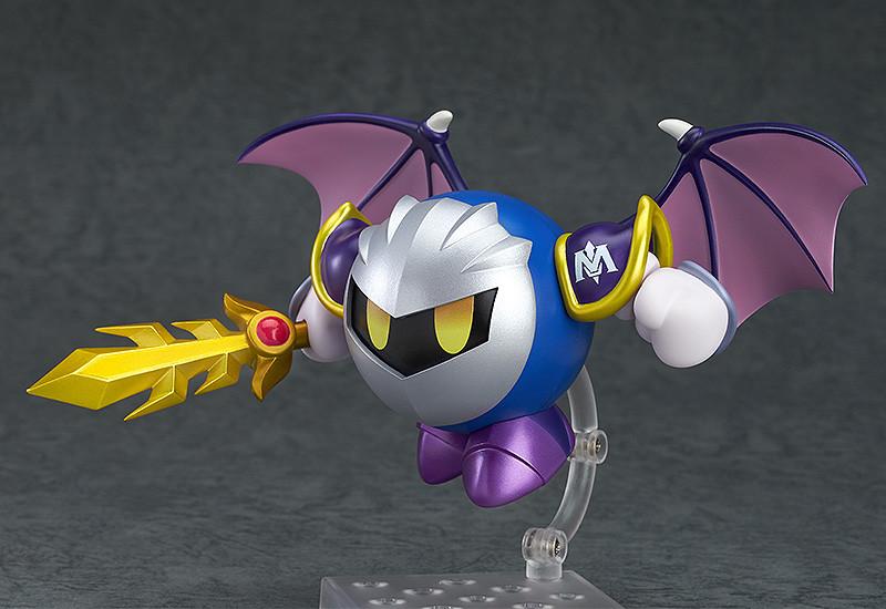 Meta Knight Nendoroid in a flying pose with interchangeable purple bat-like wing parts and his golden sword held out to the side.