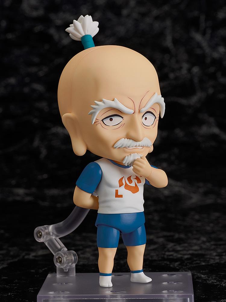 Netero Nendoroid figure utilizing the pondering face plate and stroking his white beard against a dark background.
