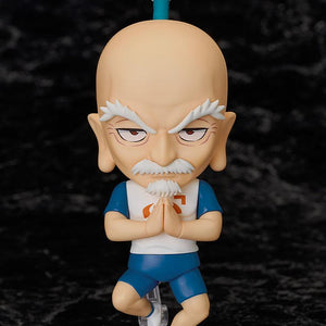 The Nendoroid Netero figure suspended on its stand in a mid-air praying pose against a dark marble background.