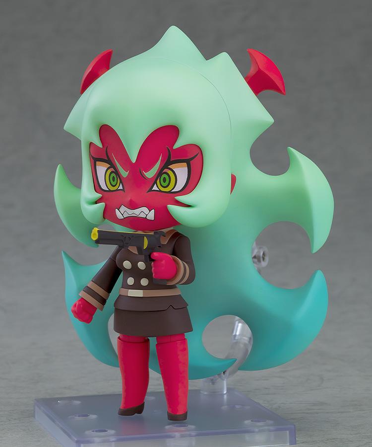 Dynamic angled view of the Scanty Nendoroid action figure with an intense expression holding a single black and gold pistol gun accessory.