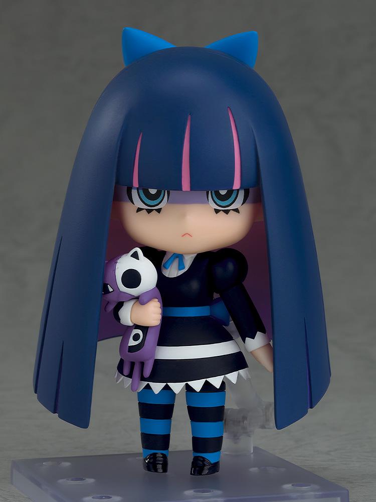 Stocking Nendoroid figure holding her purple and white plush cat companion Honekoneko while wearing blue and black striped stockings.