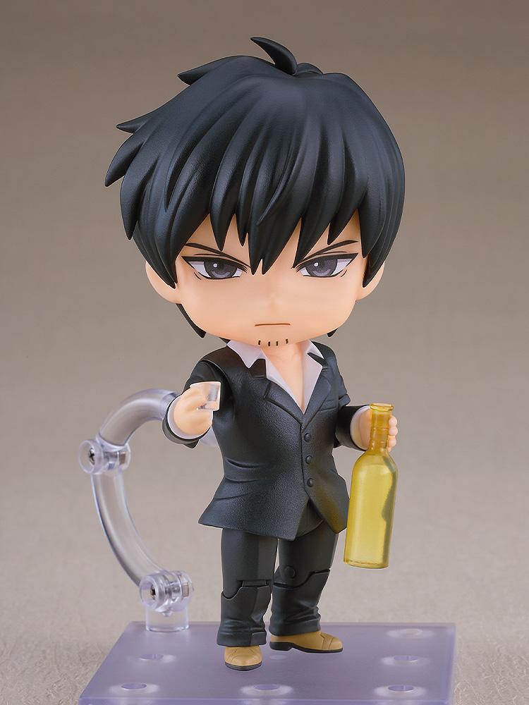 Nicholas D. Wolfwood Nendoroid figure featuring a standard serious face plate while holding an alcoholic drink glass and a yellow bottle.
