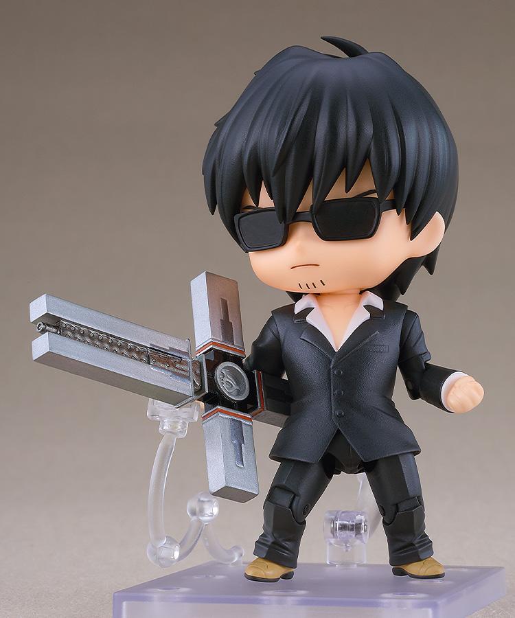 Nicholas D. Wolfwood Nendoroid wearing dark sunglasses and wielding the Punisher cross weapon in its deployed combat state.
