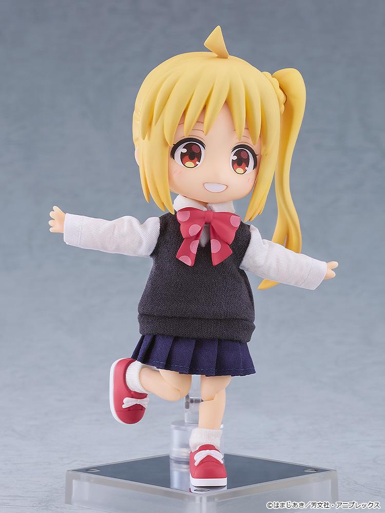Cheerful articulated Nijika Ijichi Nendoroid Doll anime figure balancing on one foot with arms spread wide in a welcoming pose.