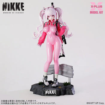 Front view of the assembled Alice model kit from Goddess of Victory: Nikke, featuring her pink bodysuit and signature twin-tail hair.
