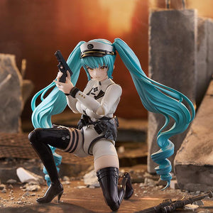 Privaty figma in a tactical crouching pose using her handgun accessory against a sunset city background.