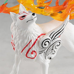 Macro portrait shot focusing on the head sculpt of the Amaterasu wolf figure, detailing the clean red facial lines, black nose, and Issun the celestial sprite.