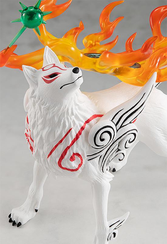 Macro portrait shot focusing on the head sculpt of the Amaterasu wolf figure, detailing the clean red facial lines, black nose, and Issun the celestial sprite.