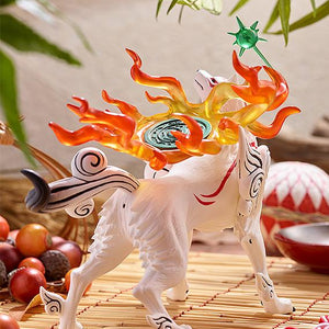 Back perspective lifestyle shot of the Amaterasu figure on a bamboo display under hanging green leaves, emphasizing the dramatic silhouette of the translucent flames.