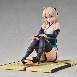 Studio shot of the 1/7 scale Fate/Grand Order Okita Souji figure in a sitting pose on a clean studio background.