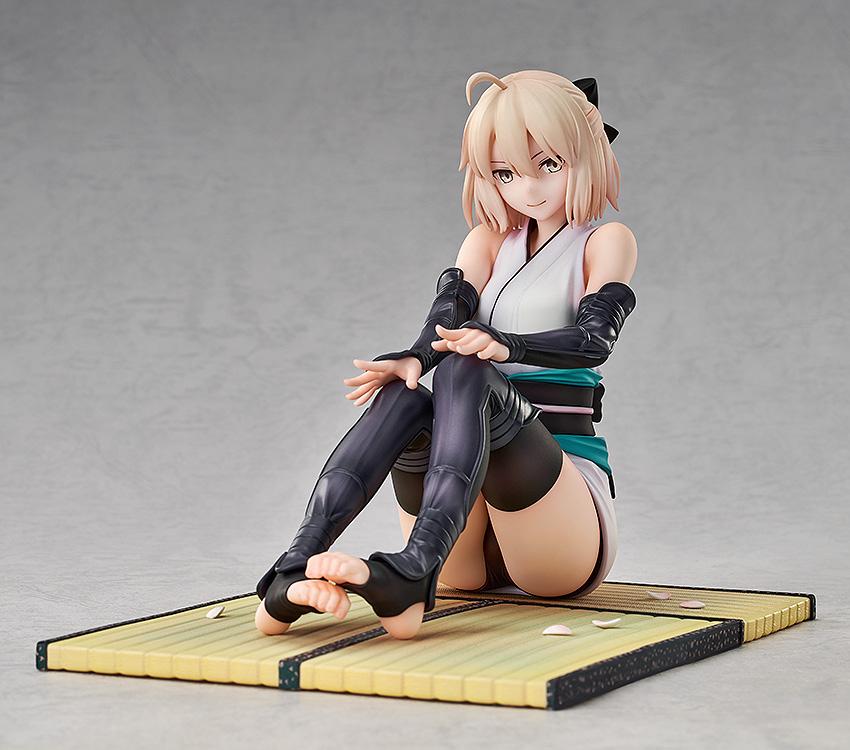 Studio shot of the 1/7 scale Fate/Grand Order Okita Souji figure in a sitting pose on a clean studio background.
