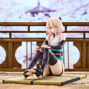 Saber Okita Souji scale figure displayed against a scenic cherry blossom and traditional Japanese temple backdrop.