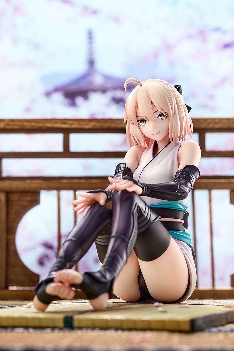 Close-up portrait of Okita Souji's Final Ascension version figure with a soft-focus cherry blossom background.