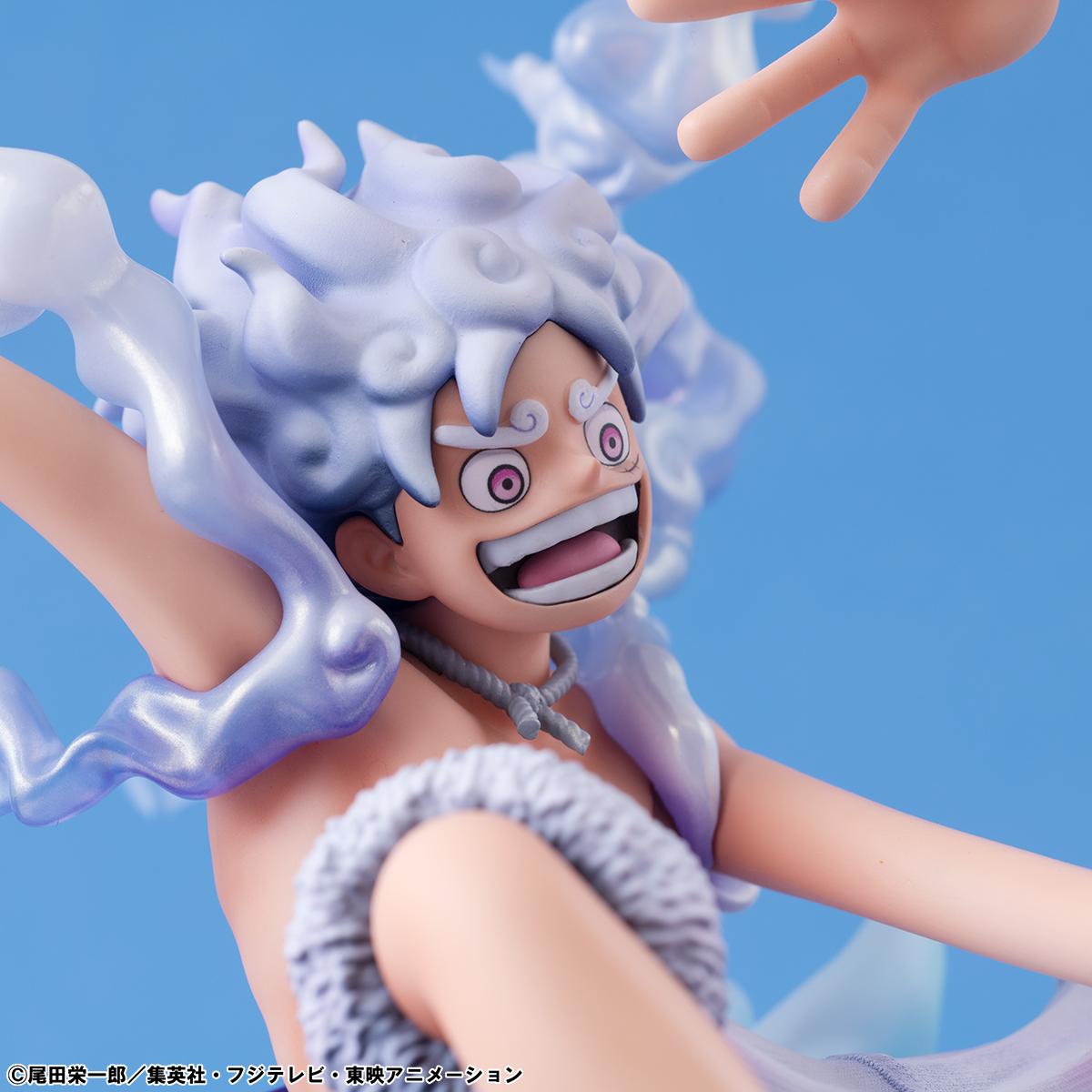 Low-angle cinematic view of the Luffy Gear 5 statue with dramatic backlighting.