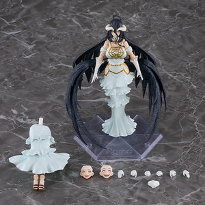 Figma Overlord Albedo action figure displayed on stand alongside included extra face plates, hand parts, and interchangeable skirt piece.