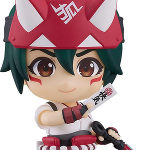 Close-up front view of the Overwatch Kiriko Nendoroid figure with green hair and a red fox headband, holding a paper healing talisman and a kunai dagger against a white background.