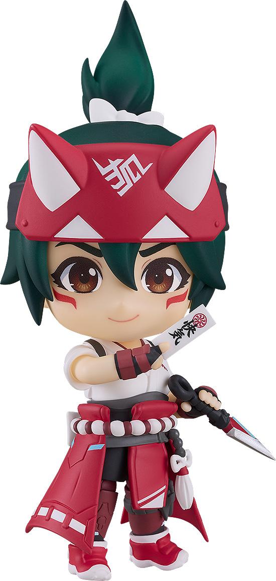 Close-up front view of the Overwatch Kiriko Nendoroid figure with green hair and a red fox headband, holding a paper healing talisman and a kunai dagger against a white background.