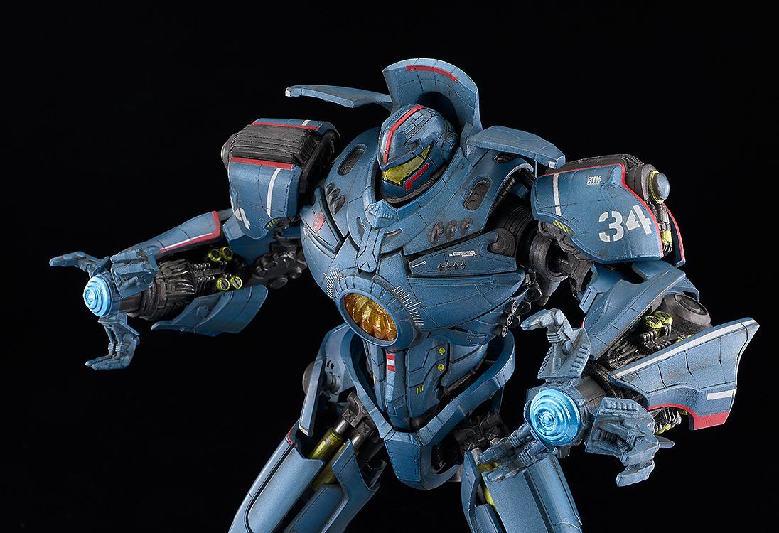 Action view of MODEROID Gipsy Danger model kit utilizing dual Plasma Cannon arm attachments with translucent blue energy effects.