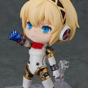 Nendoroid Aigis 2.0 figure posed performing a "Rocket Punch" action with the small blue effect part attached to her forearm.