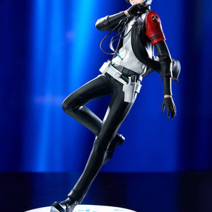 Promotional full-body photo of the Persona 3 Reload Protagonist figure posed dynamically under dramatic blue stage lighting.