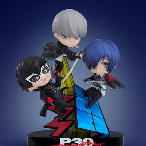 Display view of the Persona 30th Anniversary Nendoroid More vignette figure featuring Joker, Yu Narukami, and Makoto Yuki against a dark blue gradient background.